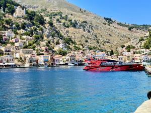 Late departure to Symi; express boat and amazing swim stop